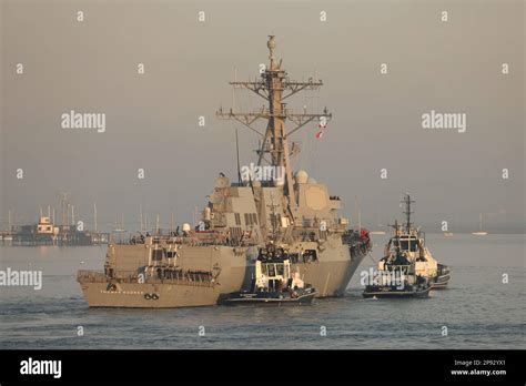 Naval Base Tugs Guide The United States Navy Destroyer Uss Thomas Hudner Towards A Berth In The